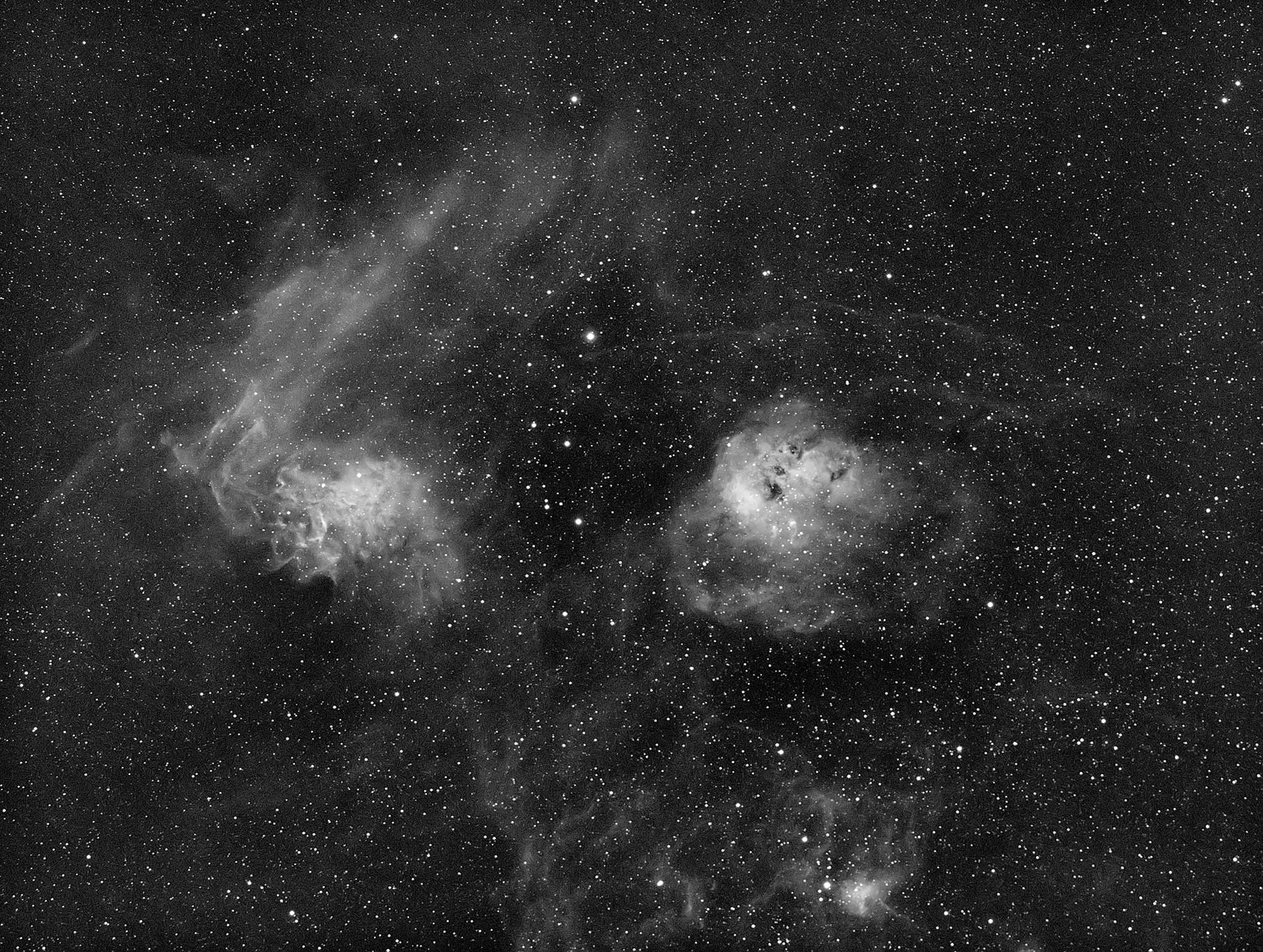 The Flaming Star nebula (IC405) to the left and NGC 1893 to the right.